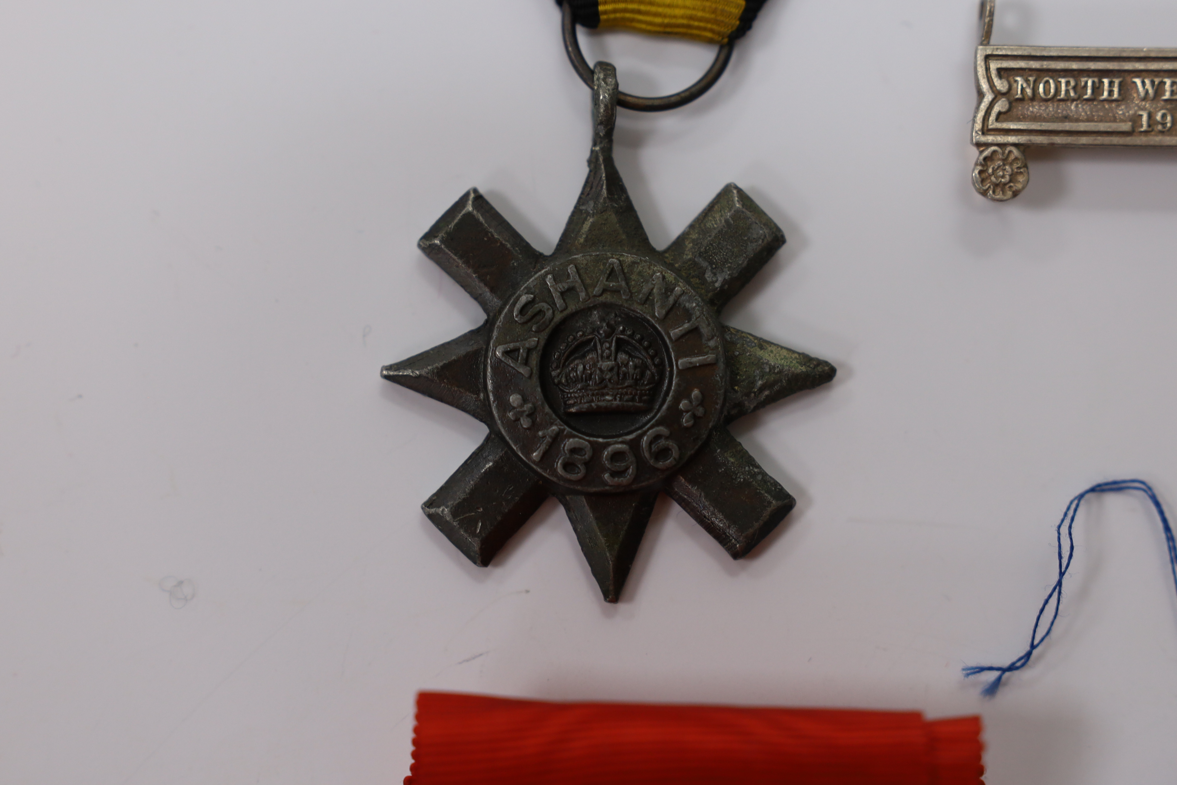 Replica medals; Khedive's Star 1884-6 and another undated; Ashanti star; Spink British North Borneo medal, a loose North West Frontier 1930-31 clasp and a Total Abstinence India medal 50-80